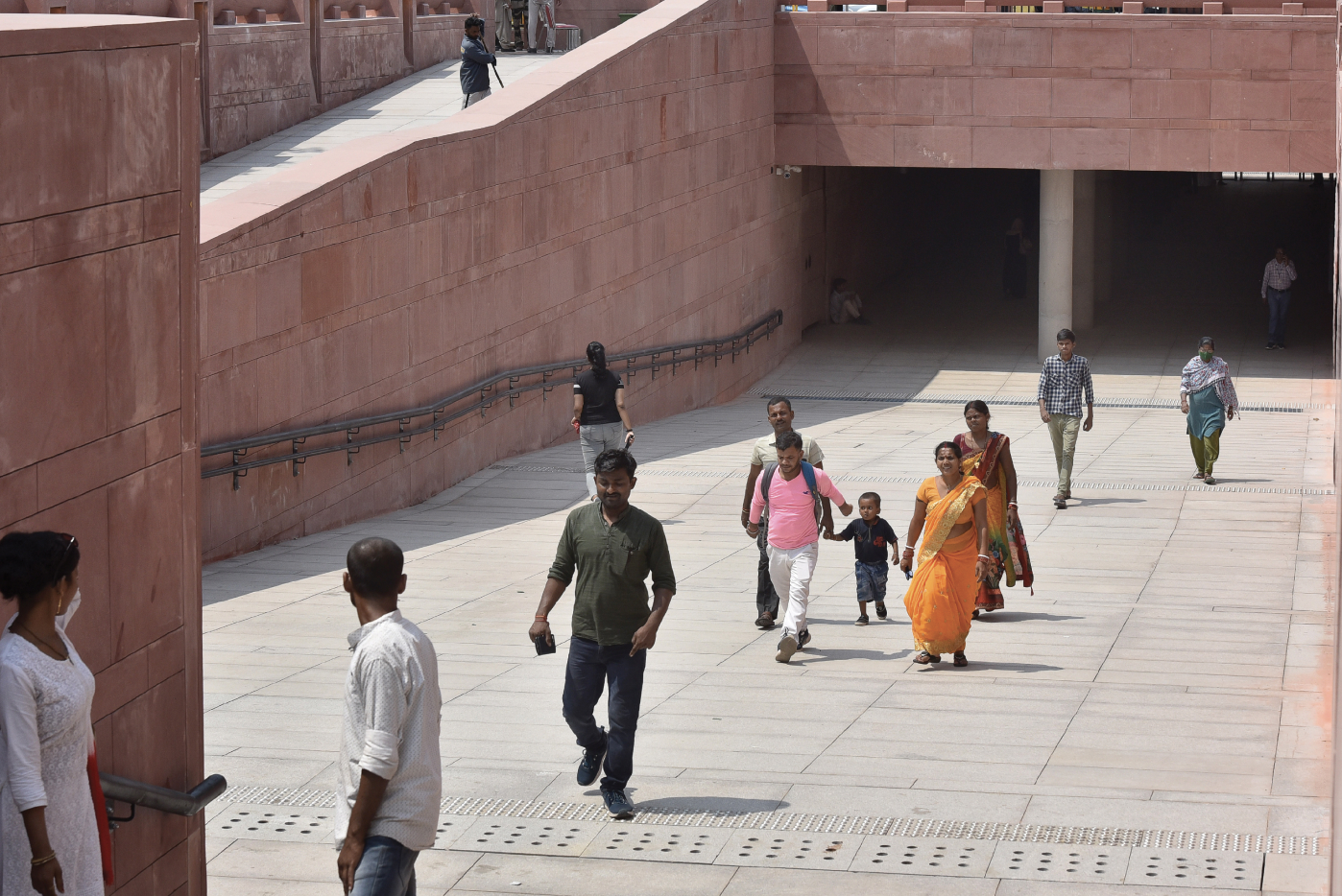 NEW DELHI, INDIA, SEPTEMBER 9, 2023: Visitors seen at the newly constructed underpass at the revamped Central Vista Avenue. The stretch of Kartavya Path from Man Singh Road towards Rashtrapati Bhawan was partially thrown open for visitors after 8.45pm on Thursday, but with barricades and security personnel in place, few made their way to the newly verdant greens.